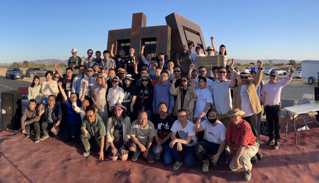 Chen Guangcheng poses with a group of human rights activists who visited the gallery this year.
